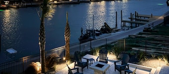 Stunning canal front home with private pool, fire pit, and boat dock