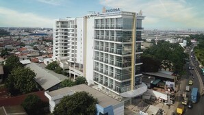 A multi-story building with the name "PADINA" on the top. - Padina Soho and Residence (Tangerang)