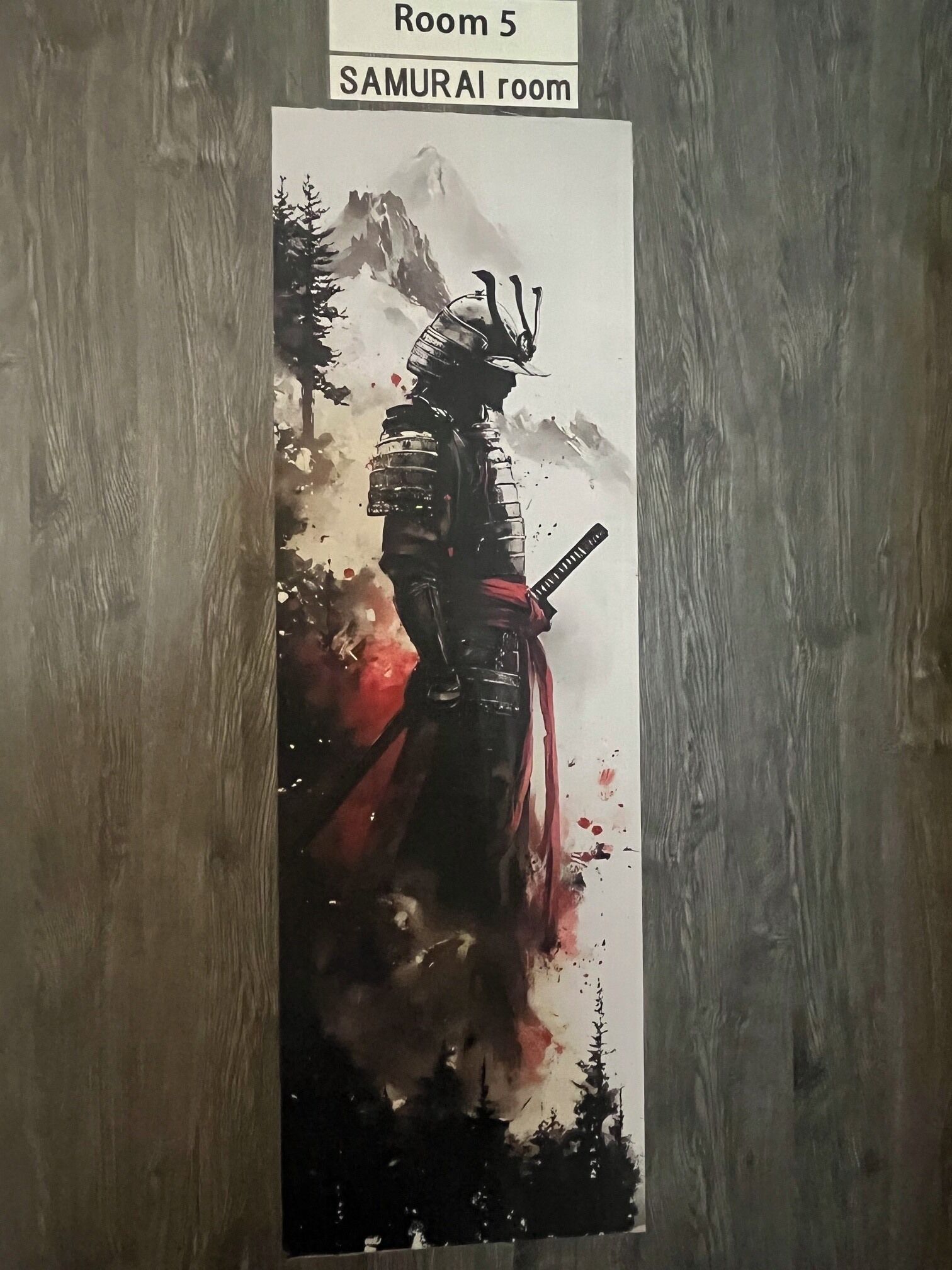 A poster of a samurai in a forest with mountains in the background, labeled 'Room 5 SAMURAI room.'