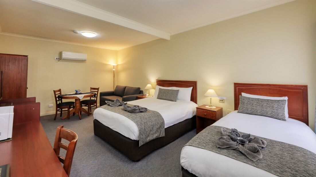 Superior Room, Multiple Beds | Laptop workspace, blackout drapes, iron/ironing board, free WiFi