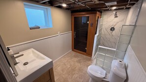 Shower, hair dryer, towels, toilet paper