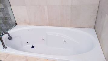 Jetted tub, towels, soap, toilet paper