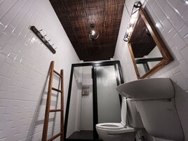 Shower, hair dryer, slippers, towels