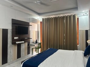 Desk, laptop workspace, blackout drapes, soundproofing - Tanvi Premium Residency (Gurugram)
