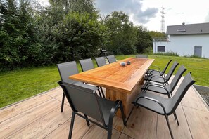 Outdoor dining - Modern natural idyll: Spacious vacation home near the Karnin lift bridge for 10 guests. (Usedom)