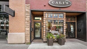 A storefront with a sign reading "CALI'S" above the entrance.