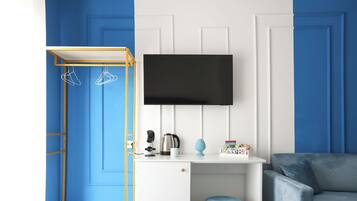 Room with blue bed | Blackout drapes, soundproofing, free WiFi