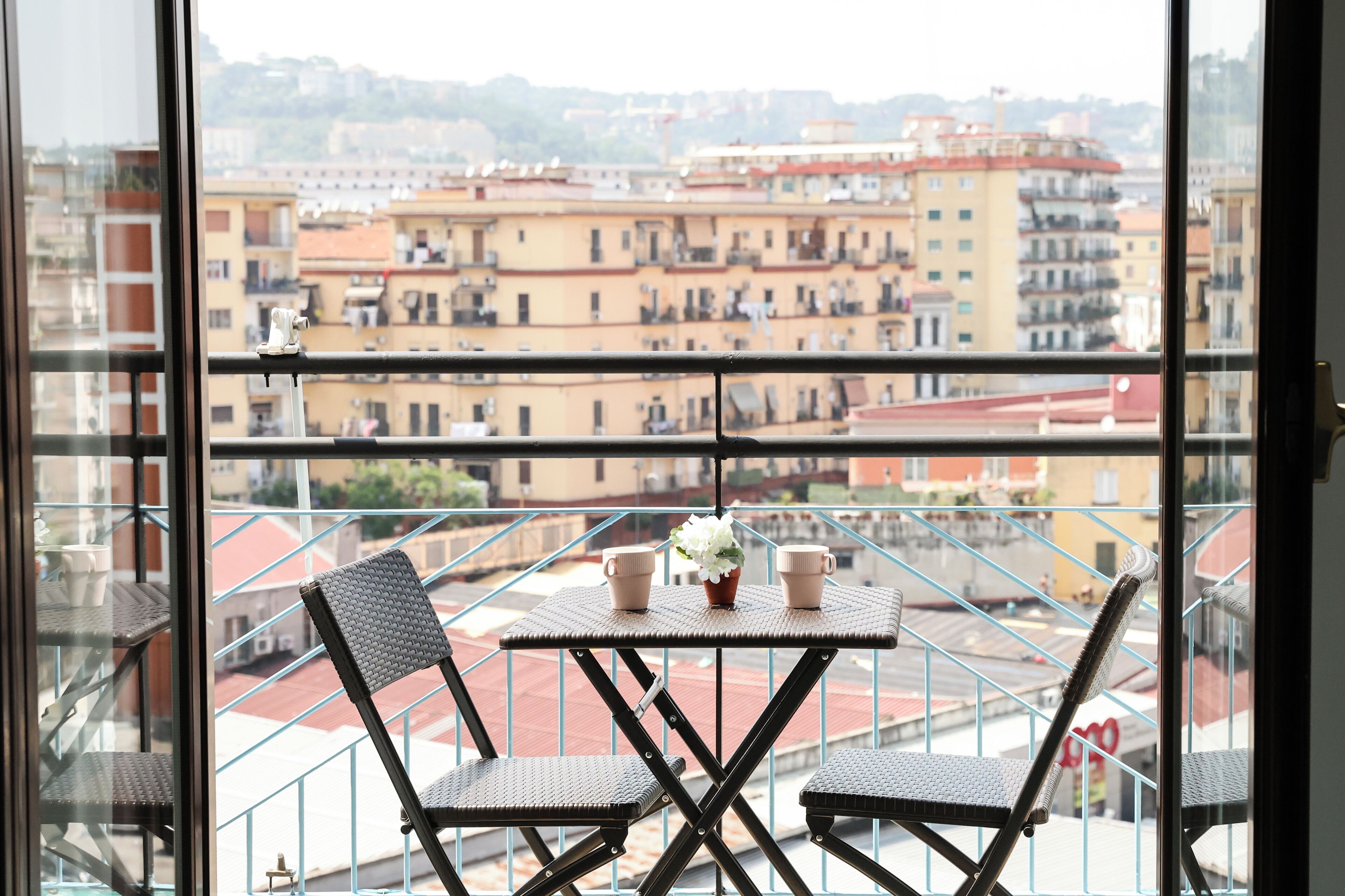 Room with green bed | Balcony