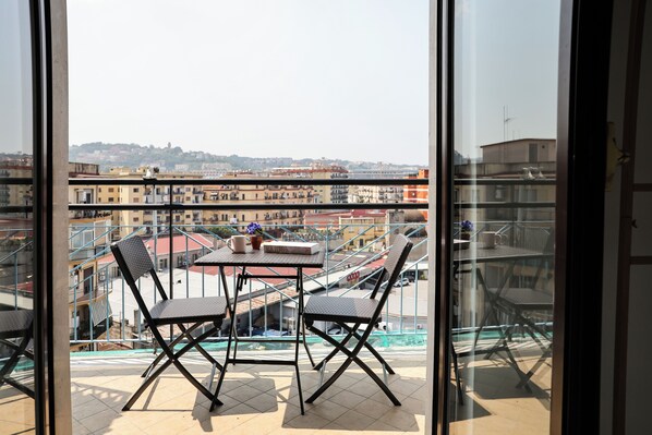 Room with pink bed | Balcony
