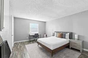 1 bedroom, desk, iron/ironing board, travel crib