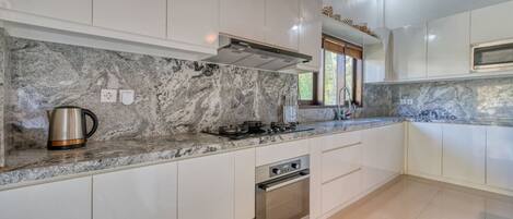 Fridge, microwave, stovetop, coffee/tea maker