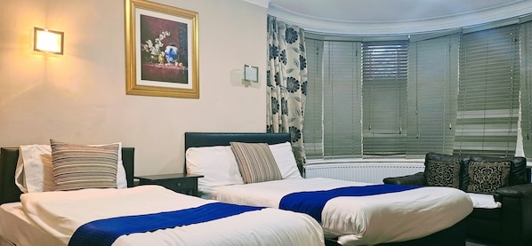 Standard Triple Room | Iron/ironing board, free WiFi
