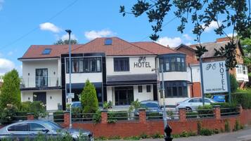 A two-story hotel with a sign indicating it is a Park Crescent hotel.