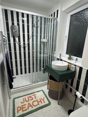 Shower, hair dryer, towels, soap