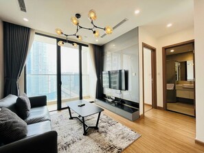 Superior Apartment, Balcony, City View | Living area | 40-inch Smart TV with digital channels