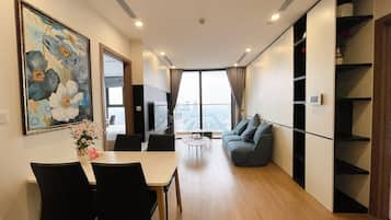 Superior Apartment, Balcony, City View | Living area | 40-inch Smart TV with digital channels
