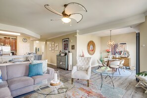 A spacious living area with a modern kitchen, a dining area with a round table, and a comfortable seating arrangement. - Walkable Condo w/ Drawbridge Views in Cambridge (Cambridge)