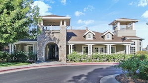 A large, two-story house with a stone entrance, multiple windows, and a covered porch. - 3 Mi to Main St Tracy: Homey Retreat w/ Game Room! (Tracy)