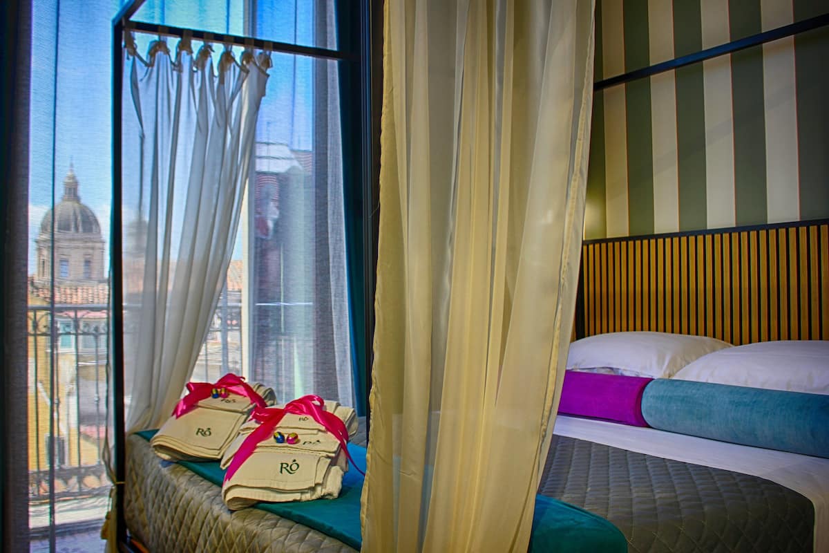 Deluxe Double Room, Balcony, City View | In-room safe, desk, laptop workspace, blackout drapes