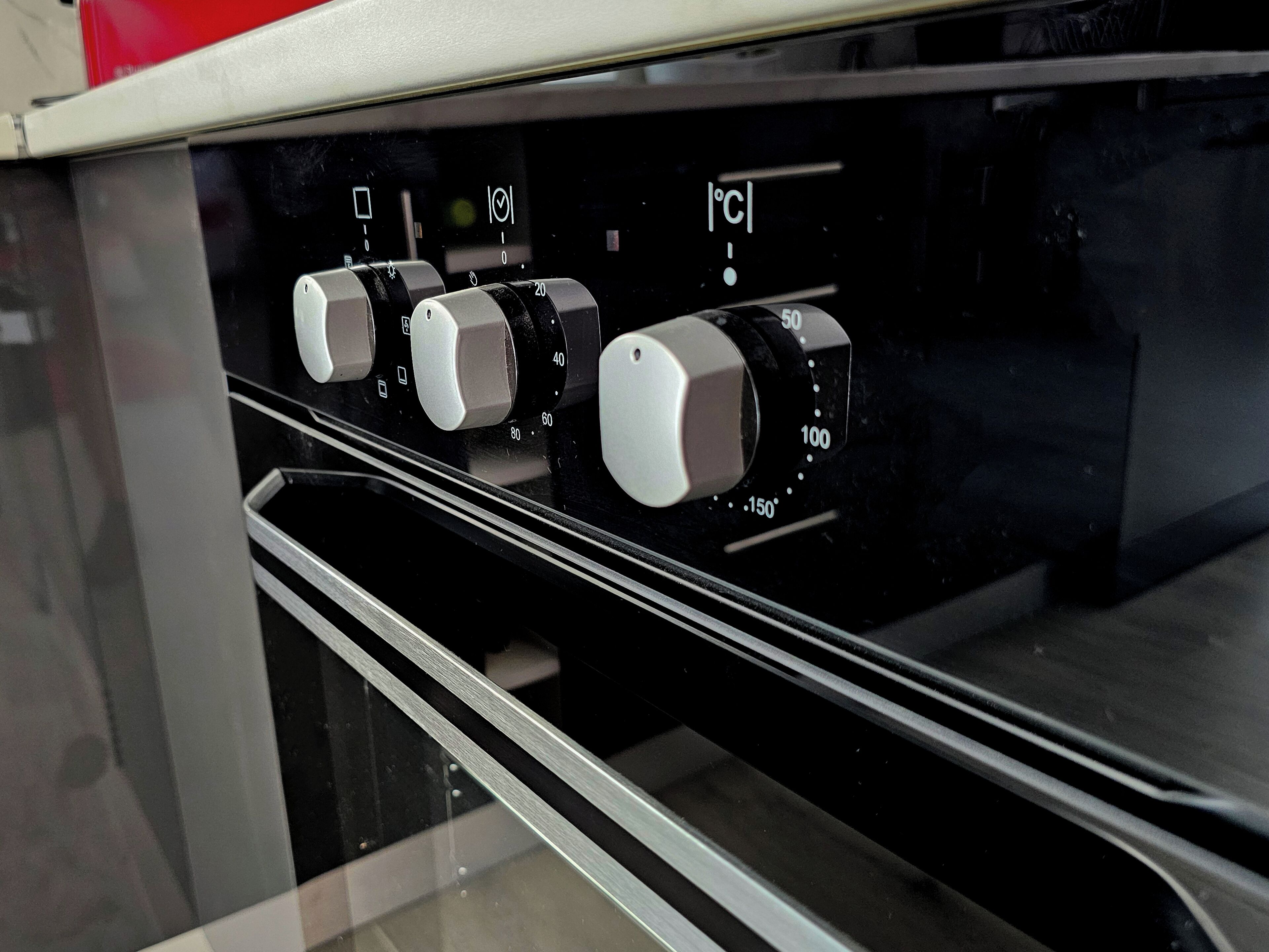 A control panel with temperature and timer settings on an oven.