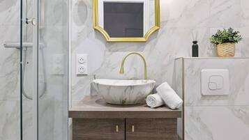 Shower, hair dryer, towels, soap