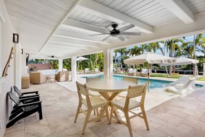 Outdoor dining - Canal front Home with Private Pool, Dock, and Game Room! Close to Beach! (Holmes Beach)