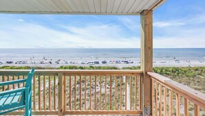 A wooden deck with a view of the beach and ocean. - Beach Escape Top Location w Pool (North Myrtle Beach)