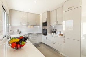 Microwave, dishwasher, coffee/tea maker, cookware/dishes/utensils