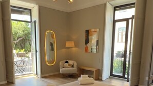 A modern bedroom with a large bed, a chandelier, a mirror, and a view of the outdoors. - Dimora Di Nardo, Zagara Apartment, front Ursino Castle in the heart of Catania (Catania)
