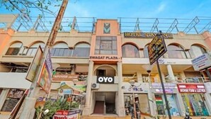 A hotel with a sign reading "HOTEL STAY IN" and "SWAGAT PLAZA". - hotel stay inn bopal (Ahmedabad)