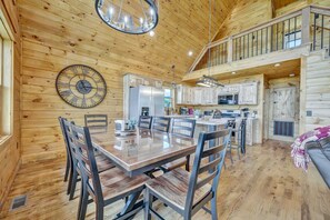 A spacious wooden interior with a dining area, kitchen, and upper level. - Brand New | Hot Tub + Grandfather Mtn + Views (Banner Elk)