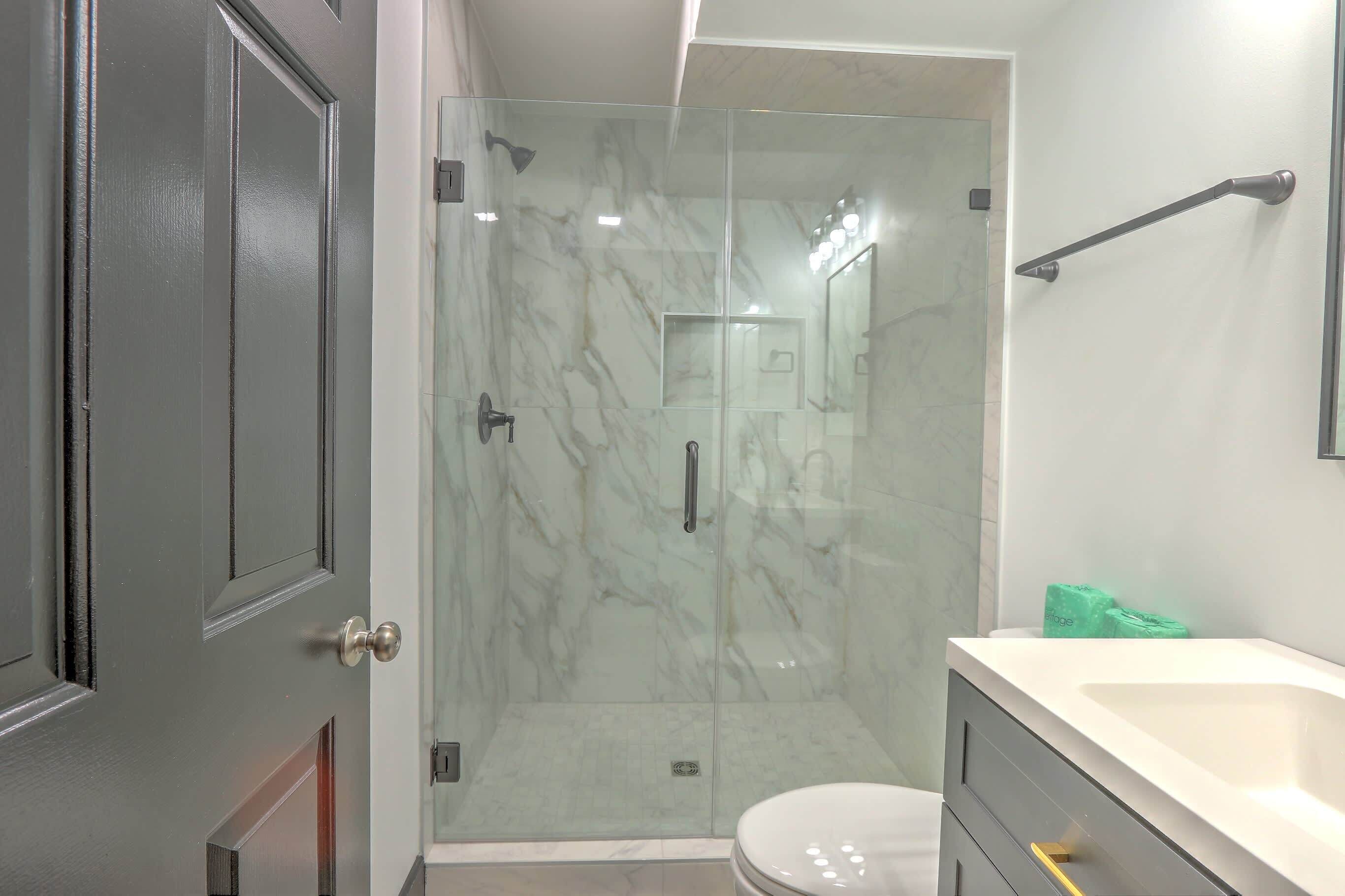 Shower, hair dryer, towels, shampoo