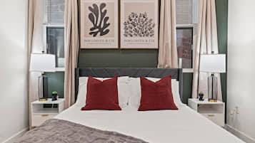 1 bedroom, desk, iron/ironing board, travel crib