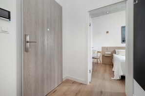 1 bedroom, desk, iron/ironing board, travel crib