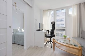 1 bedroom, desk, iron/ironing board, travel crib