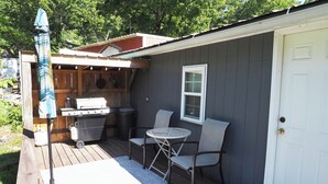 A covered outdoor area with a grill, chairs, and a table. - R&R Retreat w/Lake Access. Grand Lake Grove, OK (Wyandotte)