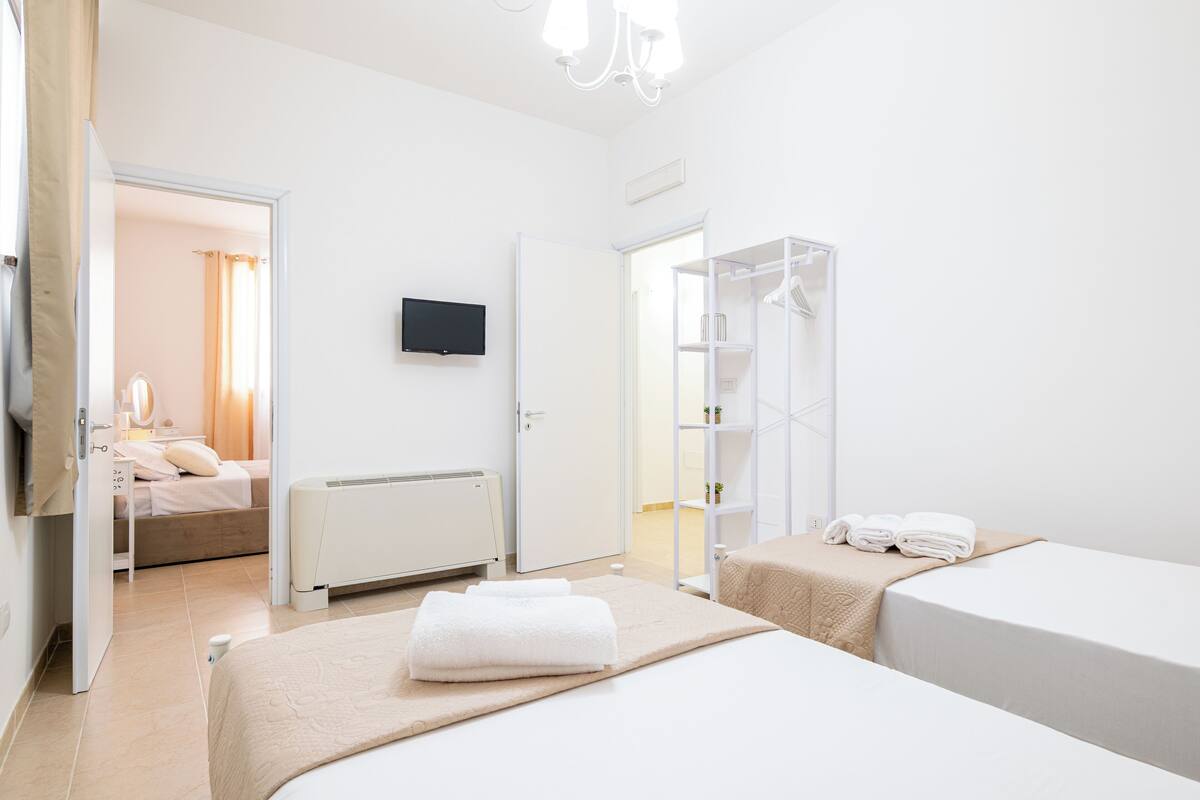 Comfort Quadruple Room, Patio | Free WiFi