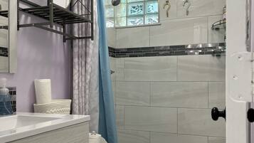 Shower, hair dryer, towels, soap