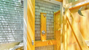 A wooden sauna with a stone base and a wooden door. - < 1 Mi to Beaches: Home w/ Deck in Oak Bluffs (Oak Bluffs)