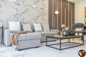Luxury Apartment, Canal View | Living area | 65-inch Smart TV with cable channels