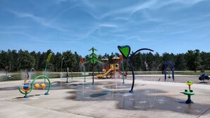 A water park with various water features and play structures. - Rome Ranch Retreat: Golf + Lake + Pool + ATV + Dog + Disc & Foot Golf too! (Nekoosa)