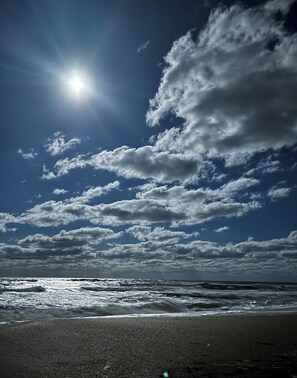 On the beach, sun-loungers, beach towels