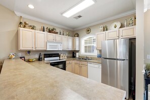 Coffee/tea maker, fridge, microwave, oven