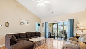 A spacious living room with a sectional sofa, a coffee table, and a recliner. - Lucky Eagle @ Myrtlewood Golf (Myrtle Beach)
