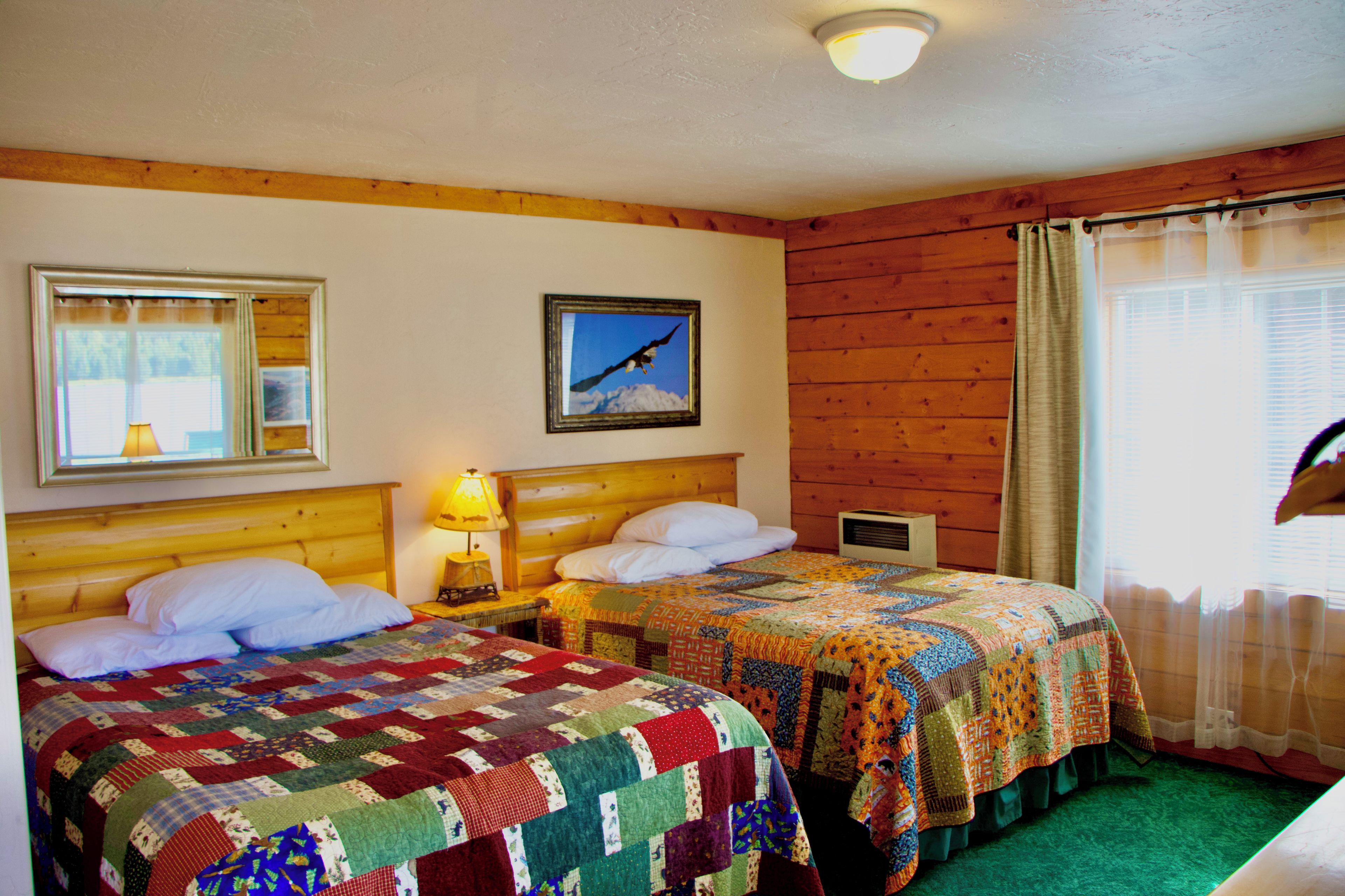 The room features a queen bed and a full bed. 