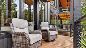 Wicker chairs with white cushions on a wooden deck. - Modern Mountain Haus - 7 bedroom/5 bath/5 decks/4 fireplaces/Theater - 6195 sqft (Blue Ridge)