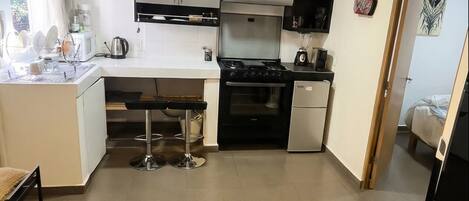 Fridge, microwave, stovetop, coffee/tea maker