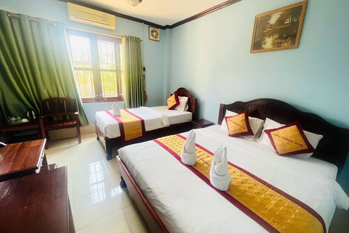 Family Room, City View | Desk, blackout drapes, iron/ironing board, free WiFi