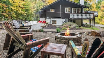 Welcome to The Crimson Cocoa Chalet! Our pet-friendly, 4-bedroom Bartlett, NH vacation rental sleeps 12 and features a private hot tub, outdoor fire pit, life-size chess, and beautiful wooded surroundings in the White Mountains.