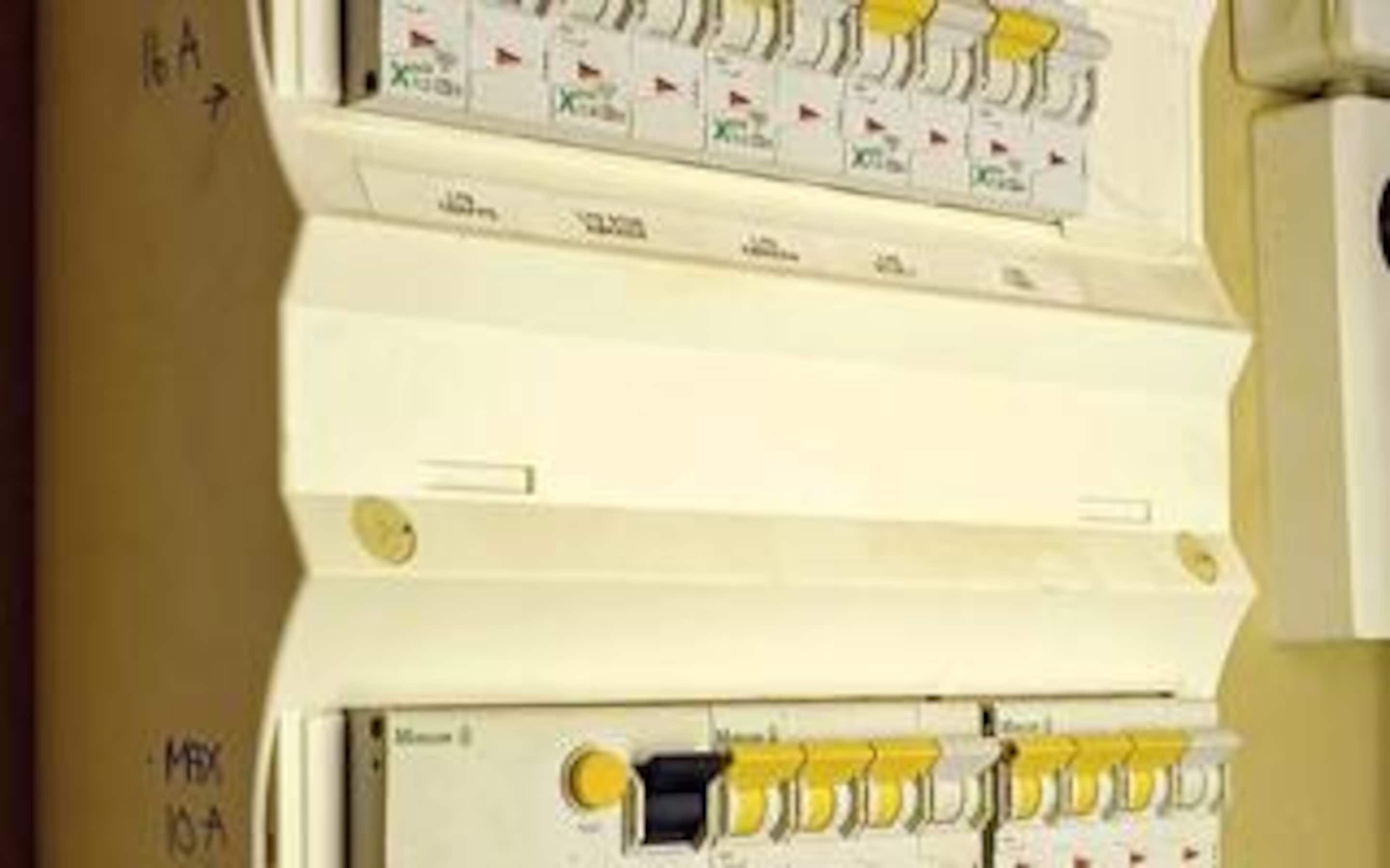 An electrical panel with multiple switches and circuit breakers.